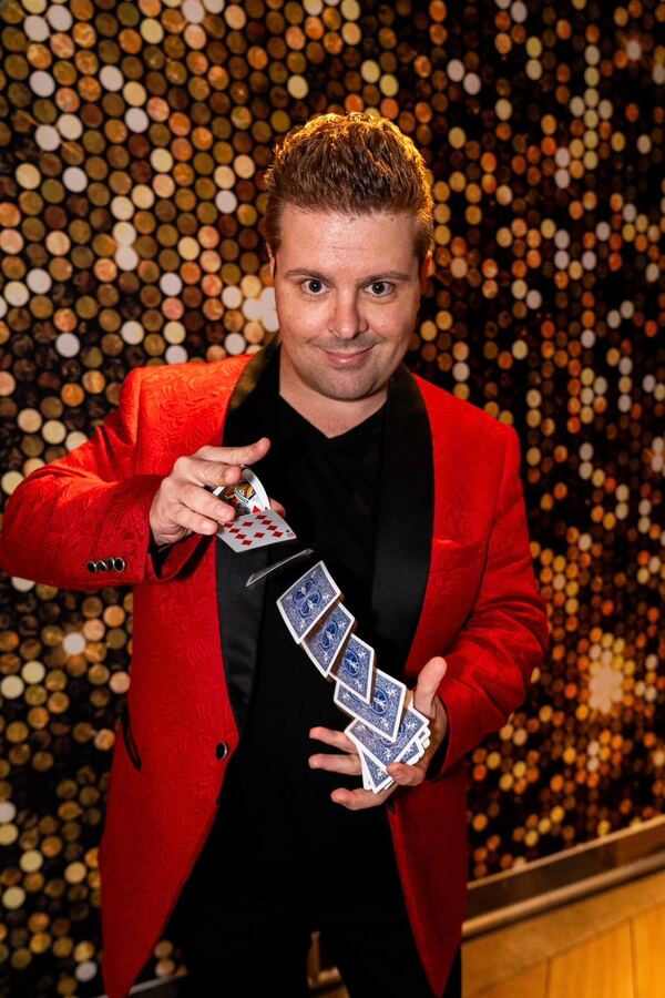 John Messina springing playing cards — performance highlight shot